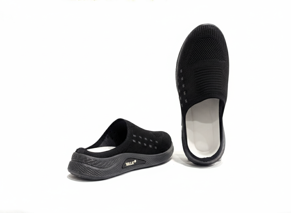 Black slip-on shoes with white soles