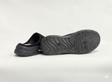 Black slip-on shoes with textured soles