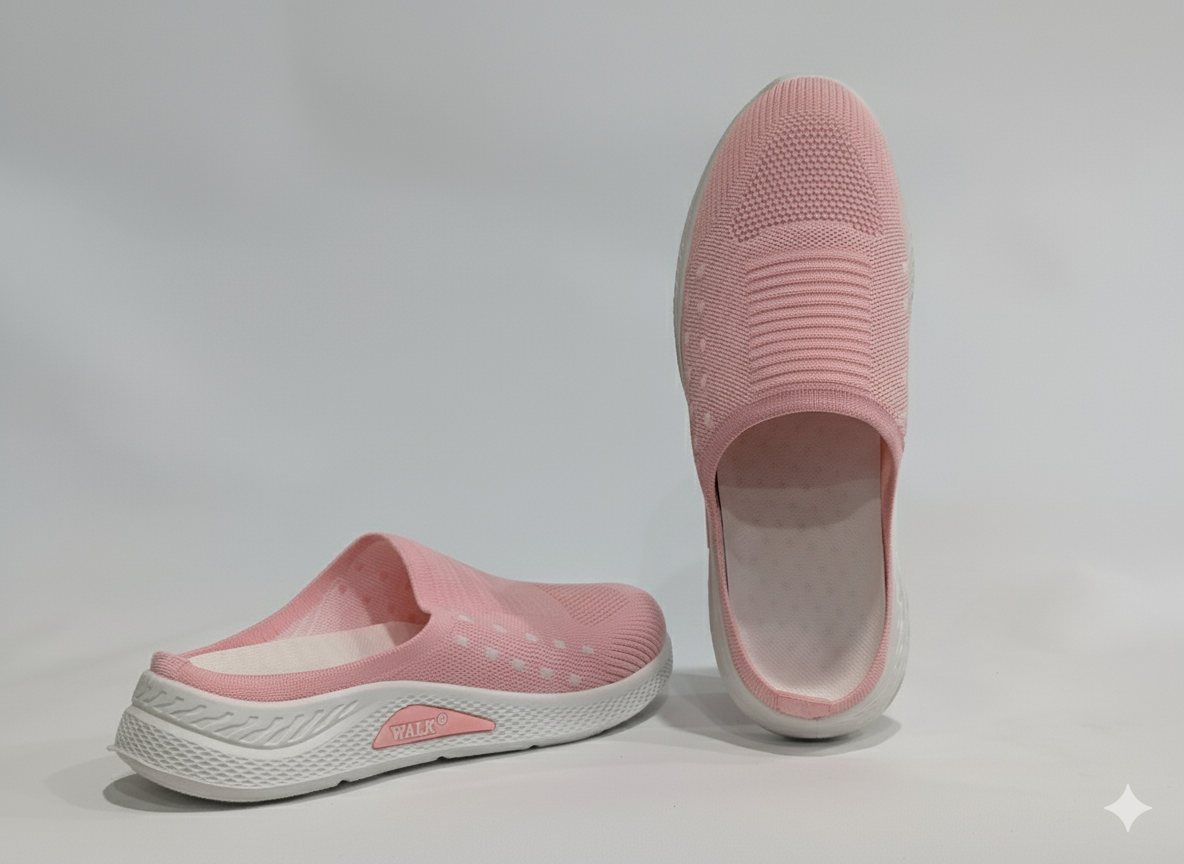 Pair of pink slip-on shoes with white soles