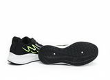 Black running shoes with green accents