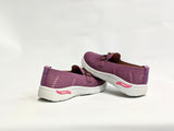 Pink slip-on shoes with white soles