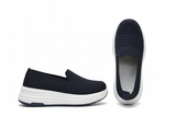 Black slip-on shoes with white sole