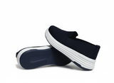 Blue slip-on shoes with white sole
