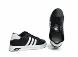 Black sneakers with visible white stripes