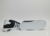 Black sneakers with visible white stripes