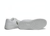 White sneakers with a text "N" Sole