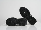 Black athletic shoes with tread pattern