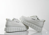 White sneakers with 'FASHION'