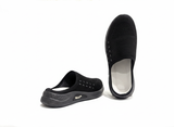 Black slip-on shoes with white soles