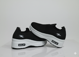Pair of black slip-on with white sole