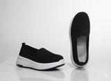 Black slip-on shoes with white sole 