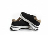 Black running shoes with white soles