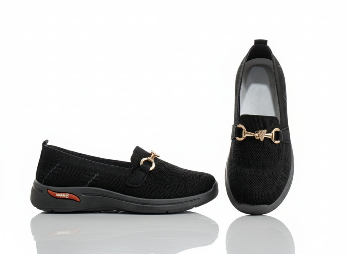 Pair of black loafers with gold accents 