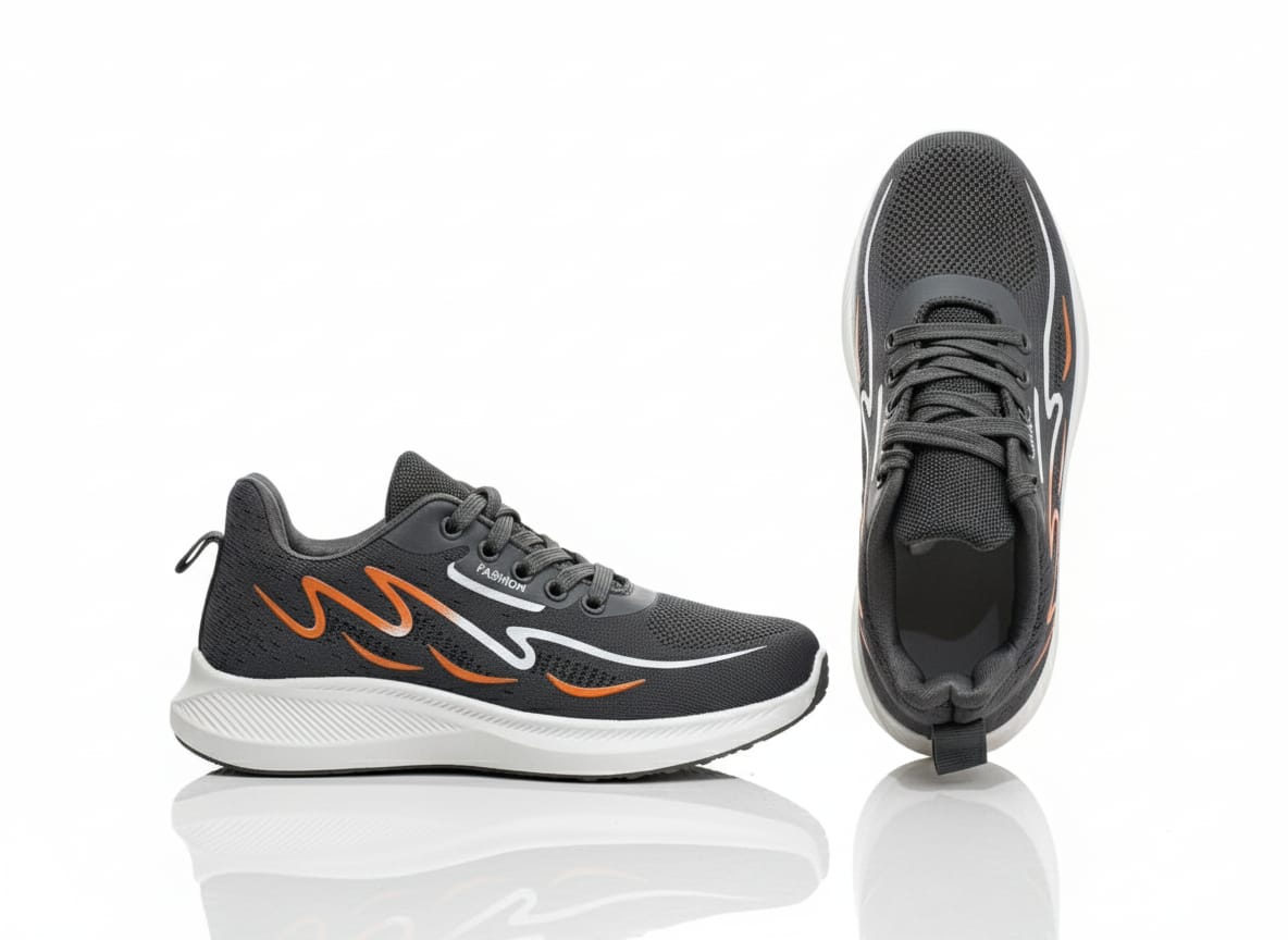 Pair of Grey and orange running shoes 