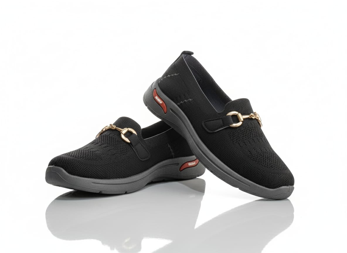 Black slip-on shoes with gold buckles 
